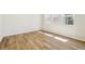 Bright bedroom with hardwood floors and large windows at 8785 Whiteclover St, Littleton, CO 80125