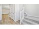 Bright entryway featuring a staircase with carpeted steps and a storage closet at 8785 Whiteclover St, Littleton, CO 80125