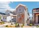 Stylish two-story home with gray siding and neat landscaping in a residential neighborhood at 8785 Whiteclover St, Littleton, CO 80125