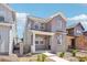 Attractive two-story home with modern siding, covered porch, and well-maintained landscaping at 8785 Whiteclover St, Littleton, CO 80125