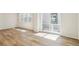 Bright living space featuring hardwood floors and a sliding glass door to the outside at 8785 Whiteclover St, Littleton, CO 80125