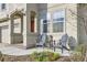 Inviting front porch featuring outdoor seating and well-maintained landscaping at 5072 Cathay St, Denver, CO 80249