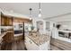 Spacious kitchen featuring an island, stainless appliances and plenty of counter space at 5072 Cathay St, Denver, CO 80249