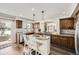 Well-equipped kitchen with granite countertops, a center island, and stainless steel appliances at 5072 Cathay St, Denver, CO 80249