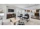 Bright living room with an open floor plan and views of the kitchen at 5072 Cathay St, Denver, CO 80249