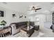 Cozy living room with tray ceilings, sofa, and views of the upstairs at 5072 Cathay St, Denver, CO 80249