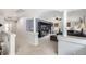 Spacious living room with media center, columns, and a view to downstairs at 5072 Cathay St, Denver, CO 80249