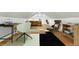Finished attic space with hardwood floors, sloped ceilings, and bright windows for a versatile living area at 2232 S Ogden St, Denver, CO 80210