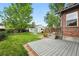 This backyard features a deck, lawn, and a detached garage at 2232 S Ogden St, Denver, CO 80210
