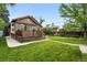 This backyard features a lawn and a wooden deck at 2232 S Ogden St, Denver, CO 80210