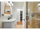 Updated bathroom features a glass enclosed shower and tiled floors at 2232 S Ogden St, Denver, CO 80210