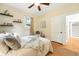 Bright bedroom with a ceiling fan, hardwood floors, and modern decor at 2232 S Ogden St, Denver, CO 80210