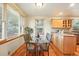 Bright dining area with glass table, wood floors, and natural light at 2232 S Ogden St, Denver, CO 80210