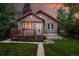 Charming brick home with a red tile roof, front porch, and manicured lawn, perfect for curb appeal at 2232 S Ogden St, Denver, CO 80210