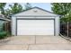 Detached two car garage with a white garage door at 2232 S Ogden St, Denver, CO 80210