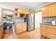 Kitchen featuring wooden cabinets, stainless steel appliances, and hardwood floors at 2232 S Ogden St, Denver, CO 80210