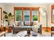 Cozy living room with hardwood floors and a comfortable couch by the windows at 2232 S Ogden St, Denver, CO 80210