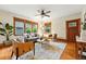 Bright living room with hardwood floors, ceiling fan, and stylish furniture at 2232 S Ogden St, Denver, CO 80210