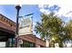 South Pearl Street sign with eclectic charm banner over a brick building at 2232 S Ogden St, Denver, CO 80210
