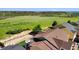 View of lush green space beyond the rooftops of a beautiful residential neighborhood at 3745 Spanish Oaks Trl, Castle Rock, CO 80108