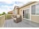 Private balcony with a comfortable armchair and a view of the surrounding neighborhood at 3745 Spanish Oaks Trl, Castle Rock, CO 80108