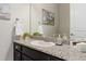 Stylish half bath with granite counters, a modern sink, and a decorative mirror at 3745 Spanish Oaks Trl, Castle Rock, CO 80108