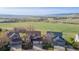 A home with scenic views of a lush green field and the tranquil waters of the nearby lake at 9586 W Victoria Dr, Littleton, CO 80128