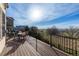 Expansive deck with black railing overlooking the yard and beautiful mountain views at 9586 W Victoria Dr, Littleton, CO 80128