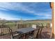 Outdoor deck with mountain views and space for outdoor dining or entertainment at 9586 W Victoria Dr, Littleton, CO 80128