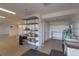 Finished basement offers storage, laundry area, shelving, and room for a workshop at 9586 W Victoria Dr, Littleton, CO 80128