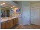Bright bathroom with a double sink vanity and a separate shower and toilet room at 9586 W Victoria Dr, Littleton, CO 80128
