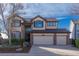 Charming two-story home with three-car garage and landscaped front yard at 9586 W Victoria Dr, Littleton, CO 80128