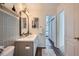 Chic bathroom featuring elegant vanity, neutral paint, and modern fixtures at 9573 Deerhorn Ct # 19, Parker, CO 80134