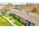 Aerial view of townhouse complex with manicured lawns and blue accents at 4201 Shoshone St, Denver, CO 80211