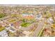An aerial view of a residential area shows the property near a street and school at 4201 Shoshone St, Denver, CO 80211
