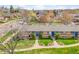 A street view shows well-maintained lawns and an apartment complex with blue doors and window accents at 4201 Shoshone St, Denver, CO 80211