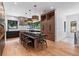 Modern kitchen featuring wood cabinets, a large center island with seating, and stainless steel appliances at 6123 Buffalo Run, Littleton, CO 80125