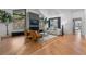 Bright living room with a fireplace, comfortable seating, and large windows at 6123 Buffalo Run, Littleton, CO 80125
