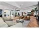 Open-concept living room with views into the dining room and kitchen at 6123 Buffalo Run, Littleton, CO 80125