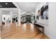 Open-concept floor plan filled with natural light from expansive windows, and complemented by modern art at 6123 Buffalo Run, Littleton, CO 80125