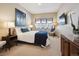 Cozy bedroom featuring a large window, stylish decor, and soft carpet at 24172 Jerome Ct, Golden, CO 80401