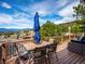 Outdoor deck with dining seating and mountain view at 24172 Jerome Ct, Golden, CO 80401