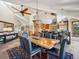 Dining room with vaulted ceilings, ornate light fixture, seating for six, and tile flooring at 24172 Jerome Ct, Golden, CO 80401