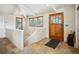 Entryway with tile flooring, wooden front door, and natural light creates a welcoming ambiance at 24172 Jerome Ct, Golden, CO 80401