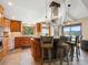 Gourmet kitchen with stainless steel appliances, breakfast bar, granite countertops and mountain views at 24172 Jerome Ct, Golden, CO 80401