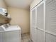 Well-organized laundry room with storage space and modern washer and dryer at 24172 Jerome Ct, Golden, CO 80401