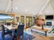 Cozy living and dining area with vaulted ceilings, wood accents, and scenic views at 24172 Jerome Ct, Golden, CO 80401