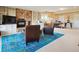 Cozy carpeted basement living room with stone fireplace, and built-in shelves, plus a view of the outdoors at 24172 Jerome Ct, Golden, CO 80401