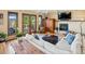 Cozy living room with a stone fireplace, comfortable seating, and access to the outdoor deck at 24172 Jerome Ct, Golden, CO 80401