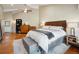 Bright main bedroom with a ceiling fan, hardwood floors and ample natural light at 24172 Jerome Ct, Golden, CO 80401